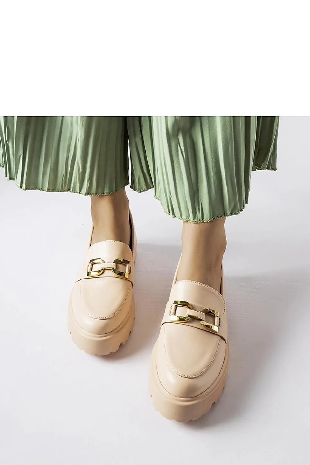 Black moccasins decorated with a buckle